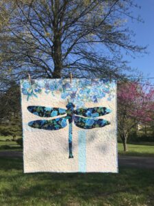 Image of dragonfly quilt made with both sides of fabric