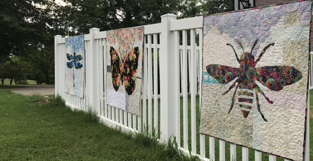 Image of Three Quilts on Fence