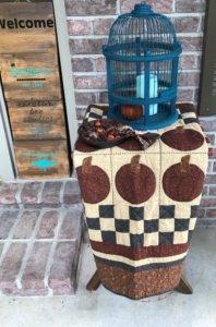 Image of quilt and bird cage