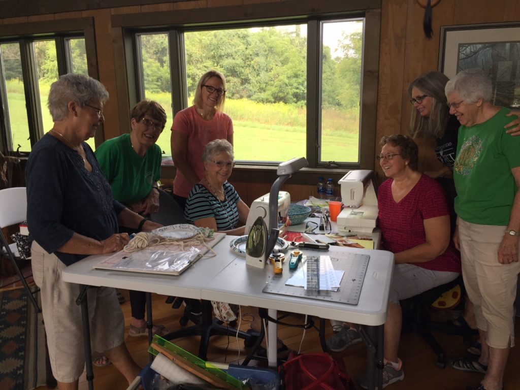 Image of demonstration at quilting cabin
