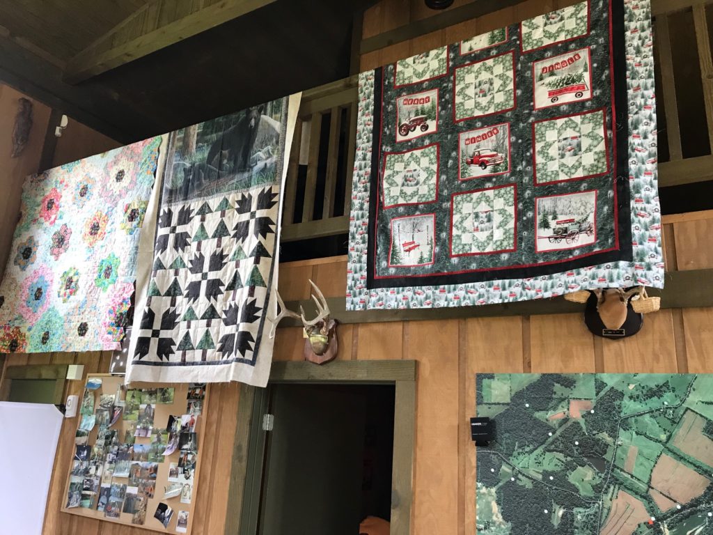 Image of Hanging Quilts at quilting cabin