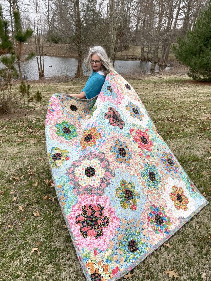 Image of Karla holding quilt