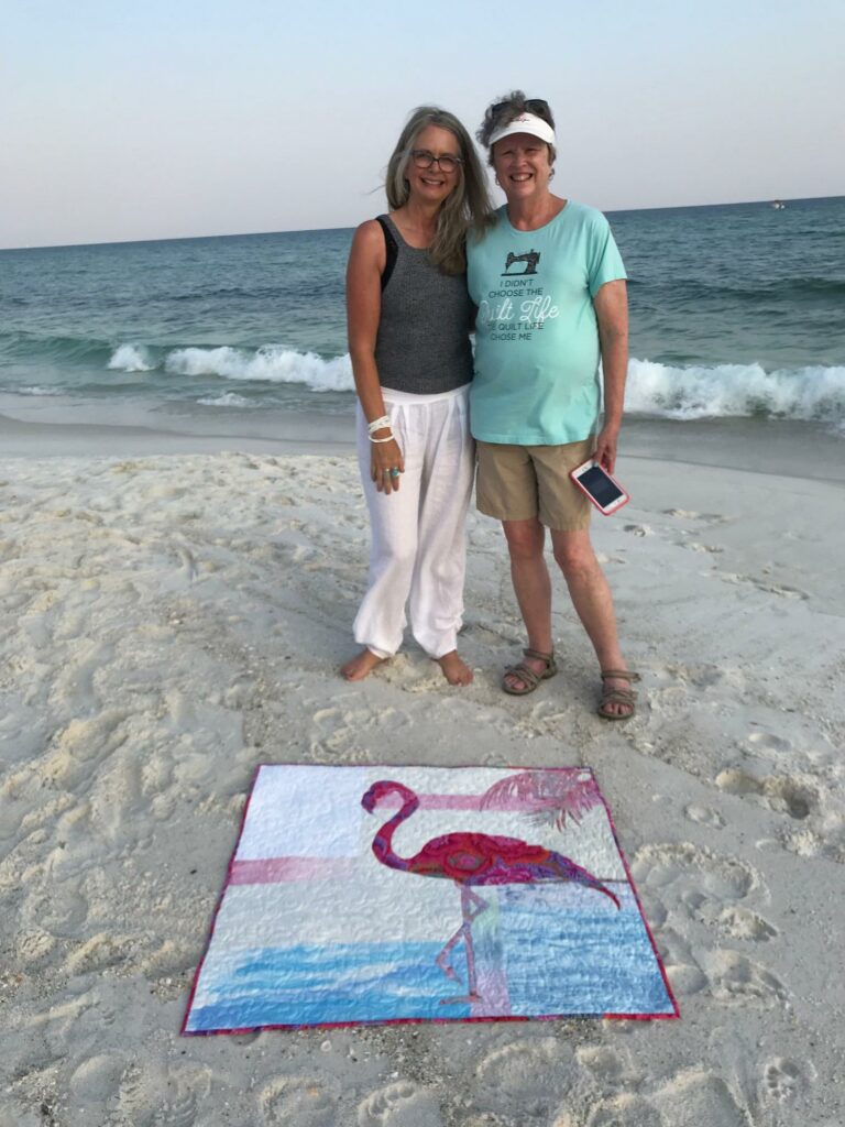 Image of Karla and Cheryl, quilters at the beach.