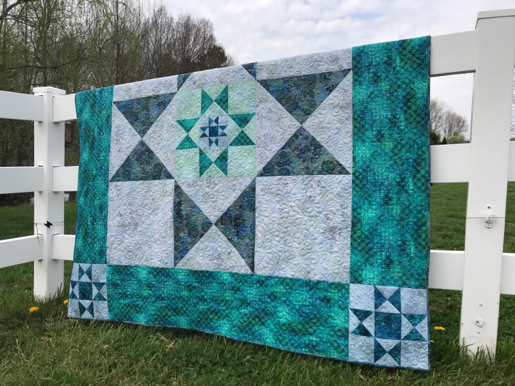 Image of Ohio Star Quilt Pattern made with classic Ohio Star block